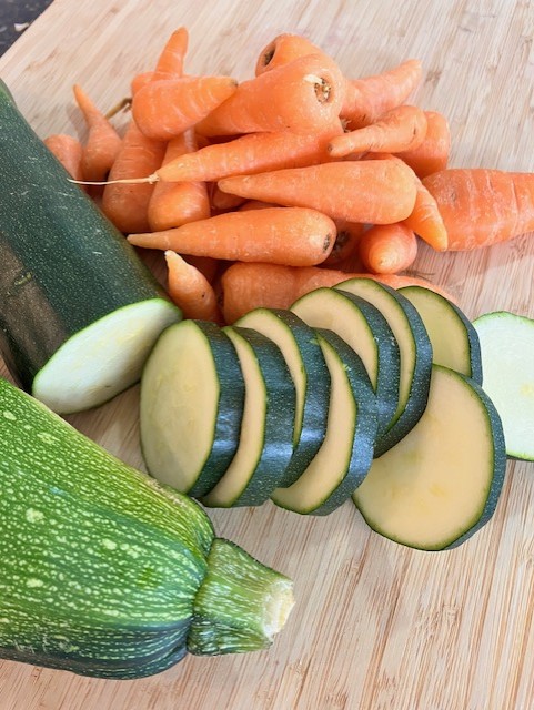 Carrots and courgettes on a chopping board