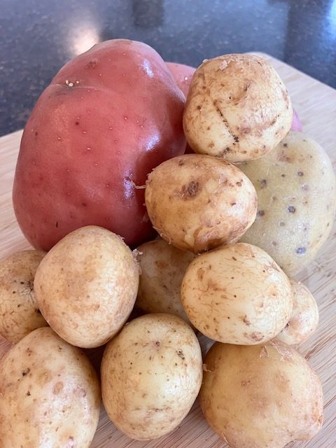 Potatoes on a chopping board