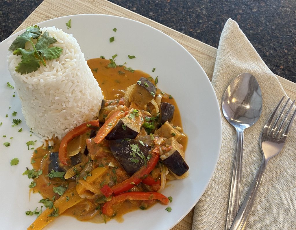 Aubergine Curry and Rice on a plate and ready to eat
