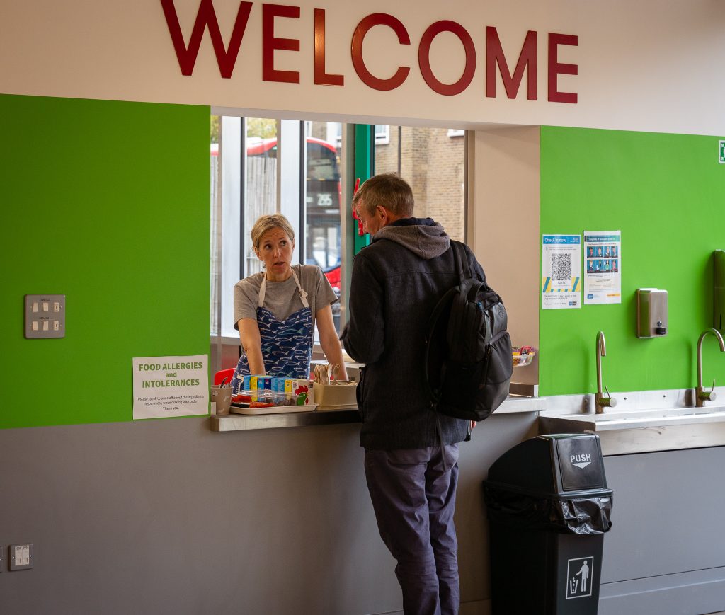 Man ordering food at Nourish Hub