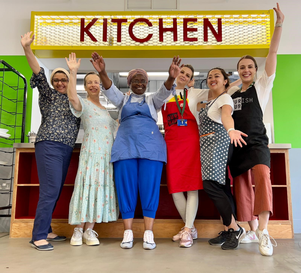 People celebrating at in a community kitchen venue