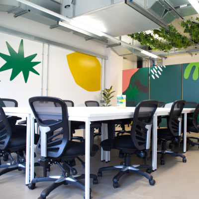Office space with bright abstract mural on wall
